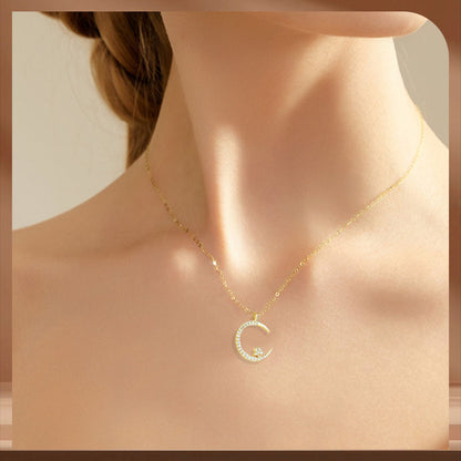 Collar brillante con luna y estrellas.